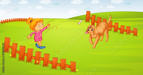 A girl playing with her dog on the meadow