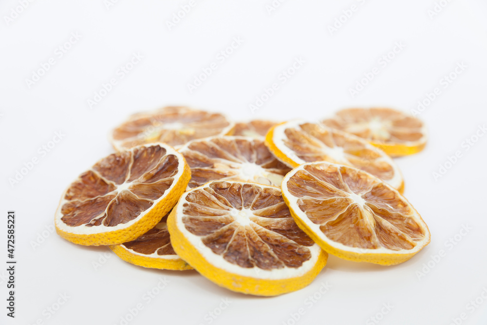 Sliced lemon. Dried lemon on a gray background. Natural light. Sliced lemon. Dried lemon on a gray background. Natural light.