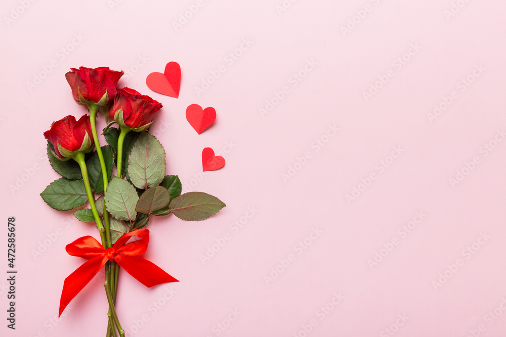 Fototapeta premium Valentine day composition with rose flower and red heart on table. Top view, flat lay, copy space Holiday concept