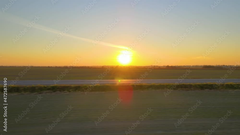 Aerial view of empty intercity road at sunset. Top view from drone of highway in evening Aerial view of empty intercity road at sunset. Top view from drone of highway in evening