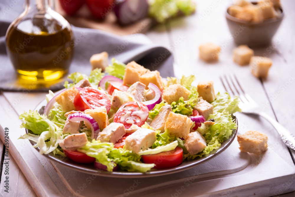 Caesar salad with vegetables, chicken and croutons Caesar salad with vegetables, chicken and croutons