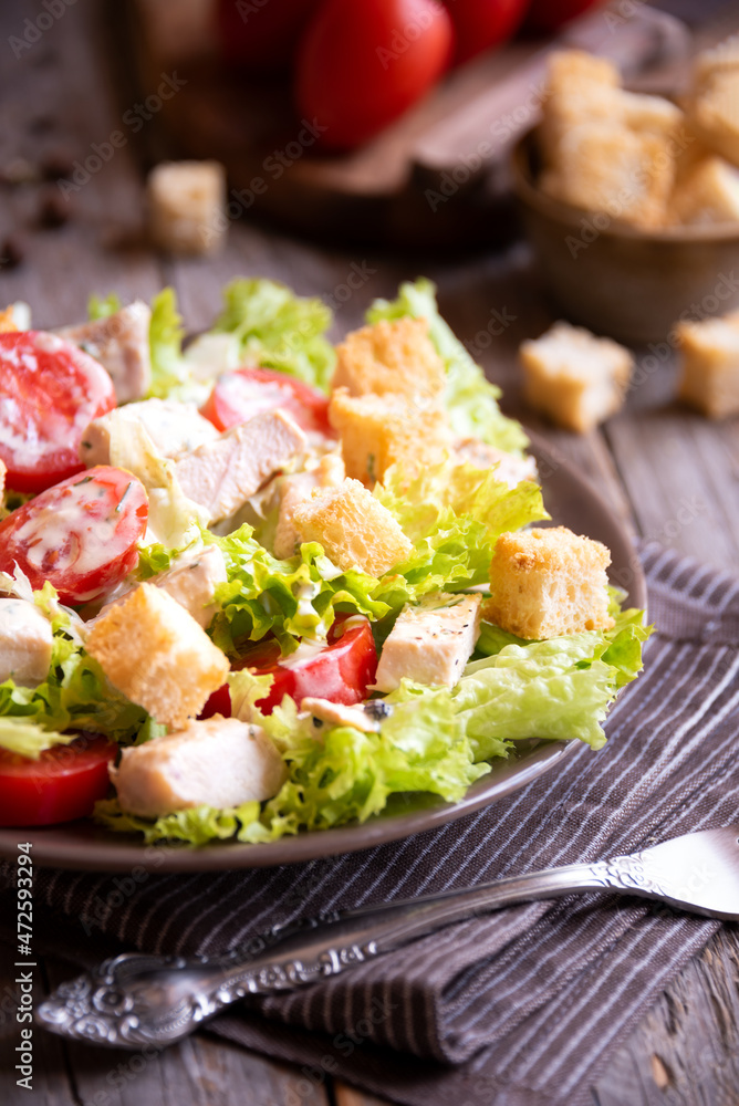 Caesar salad with vegetables, chicken and croutons Caesar salad with vegetables, chicken and croutons