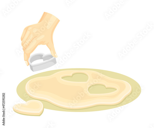 Hand using heart shaped cookie cutter to cut dough. Bakery process, homemade food vector illustration