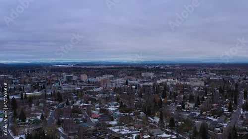 Fairbanks City on Cloudy Winter Day. Alaska, USA. Aerial View. Drone is Orbiting photo