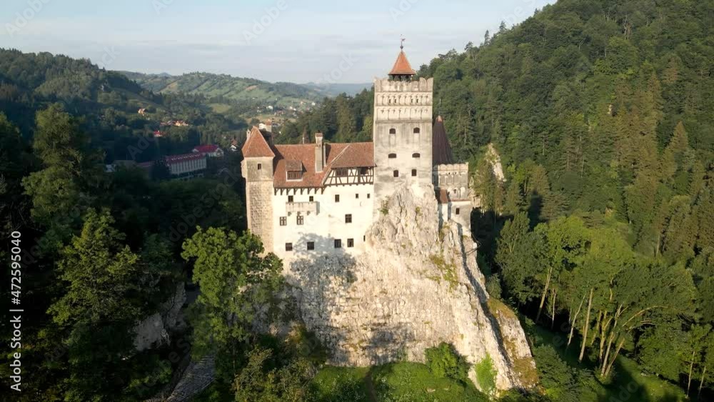 Panoramic aerial view of Bran Castle known as dracula castle in transylvania, Romania surrounded by a lush forest. Panoramic aerial view of Bran Castle known as dracula castle in transylvania, Romania surrounded by a lush forest.