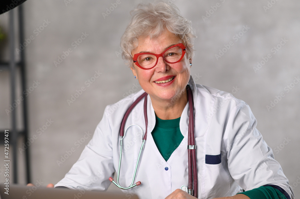 Middle age Woman doctor. Telemedicine the use of computer and  telecommunications technologies for the exchange of medical information  Stock Photo | Adobe Stock