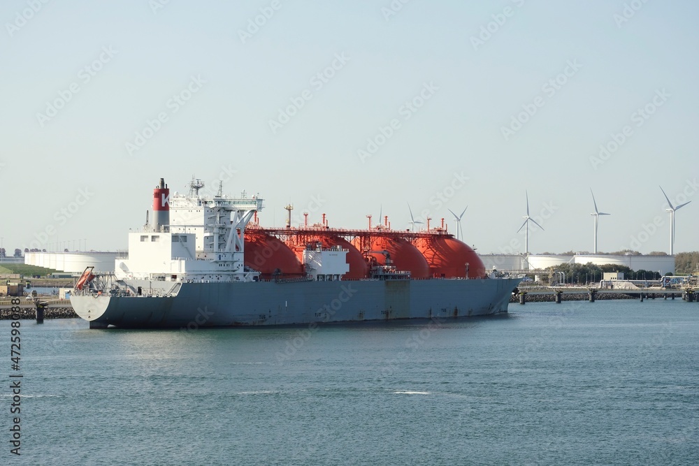 Port of Rotterdam, Netherlands - 07 29 2020: LNG tanker Arctic Voyager during loading operations in the port of Rotterdam Port of Rotterdam, Netherlands - 07 29 2020: LNG tanker Arctic Voyager during loading operations in the port of Rotterdam