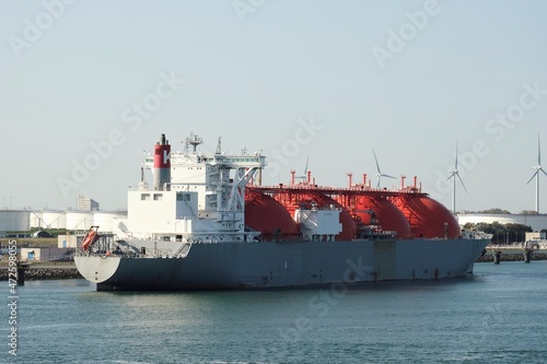 Port of Rotterdam, Netherlands - 07 29 2020: LNG tanker Arctic Voyager during loading operations in the port of Rotterdam