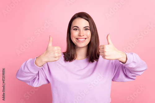 Photo of youth excited lady show thumbs-up approve good quality great isolated over pink color background