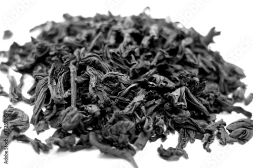 Dry tea isolated on white with blur effect in black and white.