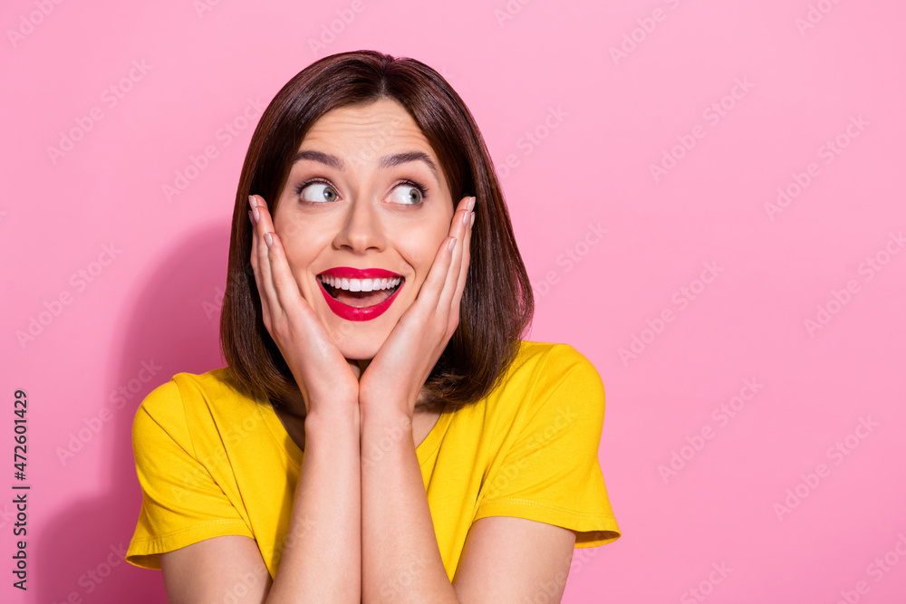 Photo of dreamy excited young lady dressed yellow clothes smiling arms cheeks looking empty space isolated pink color background Photo of dreamy excited young lady dressed yellow clothes smiling arms cheeks looking empty space isolated pink color background
