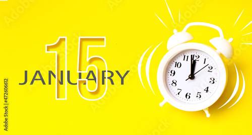 Wallpaper Mural January 15th. Day 15 of month, Calendar date. White alarm clock with calendar day on yellow background. Minimalistic concept of time, deadline. Winter month, day of the year concept. Torontodigital.ca