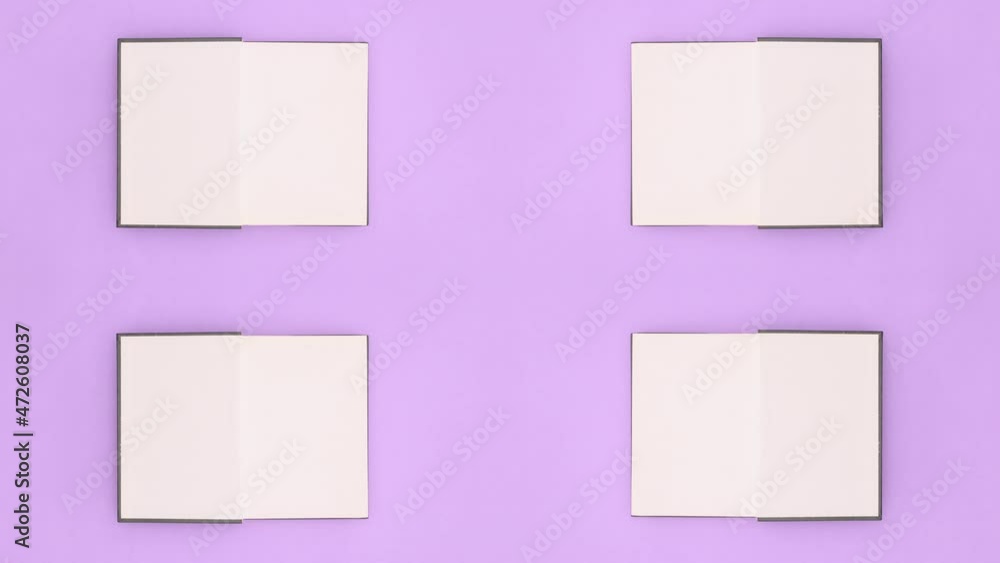 Four green books appear and open on purple theme. Stop motion Four green books appear and open on purple theme. Stop motion