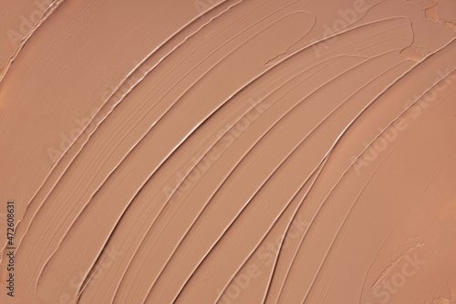 Liquid foundation texture background, beige concealer paint smears