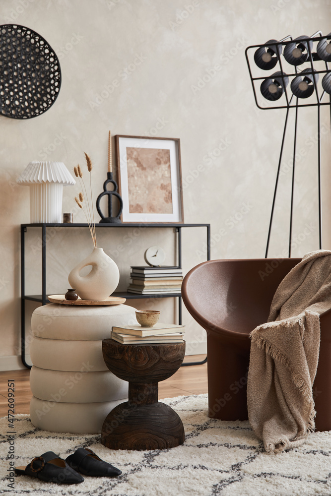 Obraz premium Modern elegnat living room interior design with creative armchair, console, mock up poster frame, lamp and stylish personal accessories. Copy space. Template.