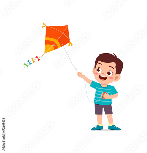 cute little boy play kite outside and feel happy