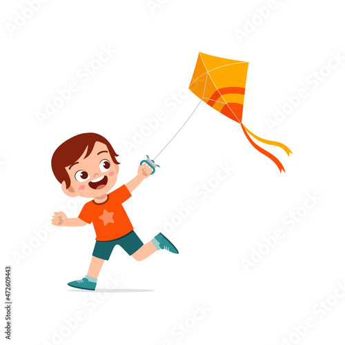 cute little boy play kite outside and feel happy