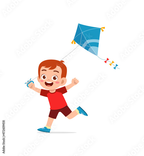 cute little boy play kite outside and feel happy