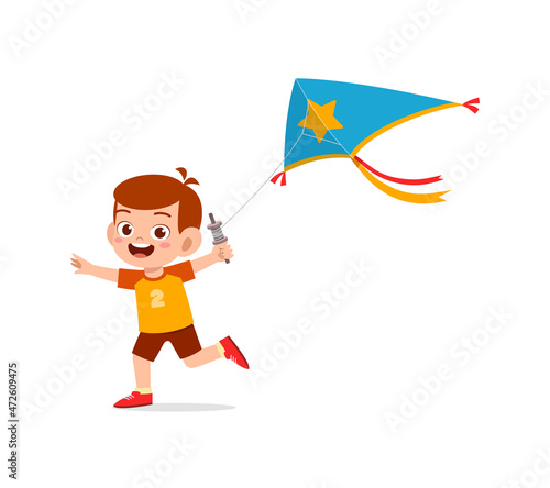 cute little boy play kite outside and feel happy