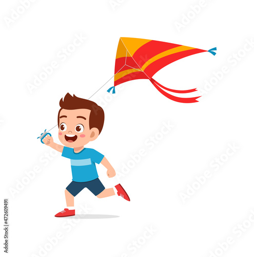 cute little boy play kite outside and feel happy