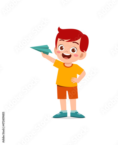 cute little boy play paper plane and feel happy