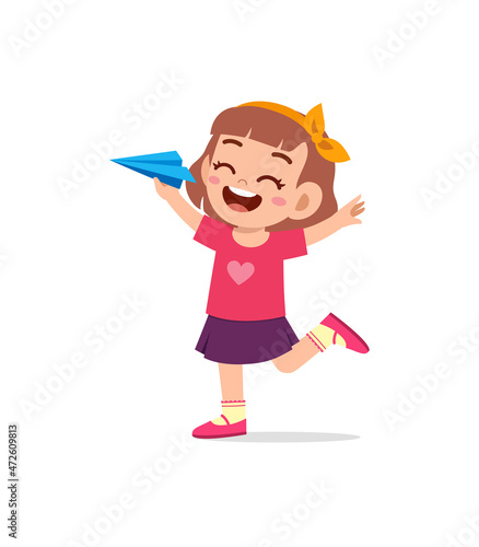 cute little girl play paper plane and feel happy