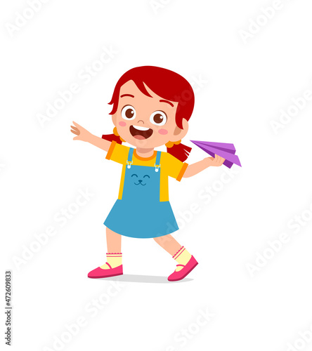 cute little girl play paper plane and feel happy