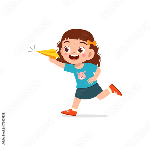 cute little girl play paper plane and feel happy