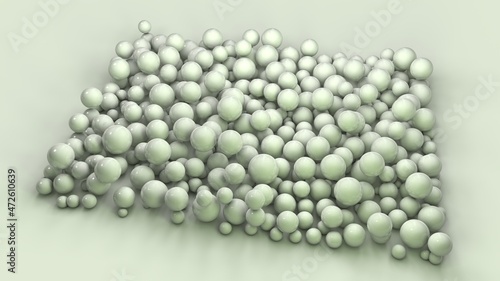 3d rendering of a variety of green spheres of different sizes on the surface. The spheres are arranged in a square. Abstract 3d composition.
