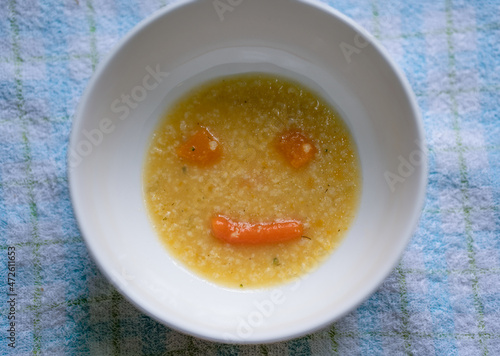 Carrot and pumpkin soup in the form of a smile. Positive attitude and delicious healthy food. Soup for the baby smiles