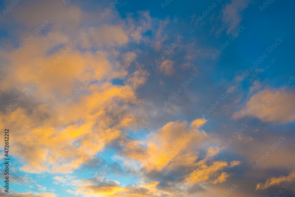 Clouds in a blue sky in bright sunlight at sunrise in autumn, Almere, Flevoland, The Netherlands, November 29, 2021
