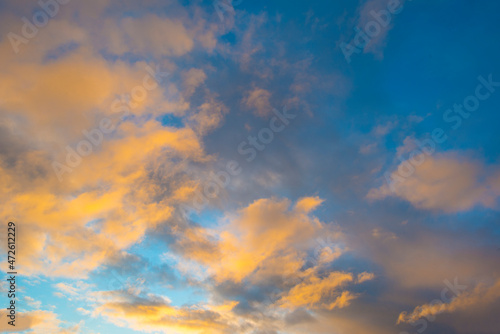 Fototapeta Naklejka Na Ścianę i Meble -  Clouds in a blue sky in bright sunlight at sunrise in autumn, Almere, Flevoland, The Netherlands, November 29, 2021
