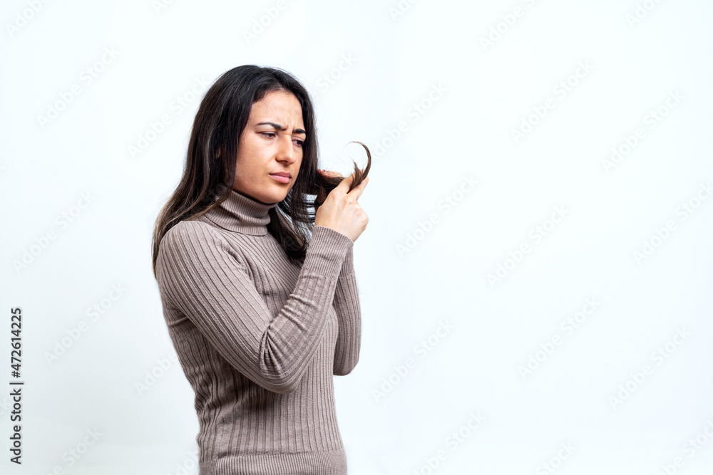 Close up photo of young woman with serious hair problems. Hair loss and care concept. Close up photo of young woman with serious hair problems. Hair loss and care concept.