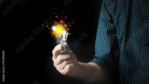 Man holding light bulbs, ideas of new ideas with innovative