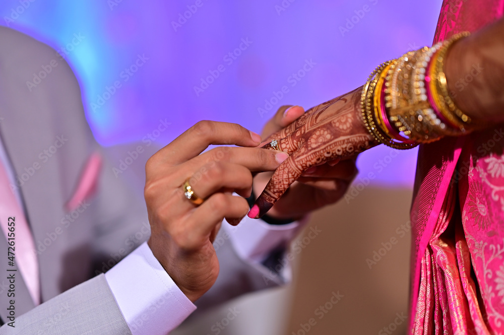 Engagement Ring ceremony, Indian wedding couple exchange rings ritual