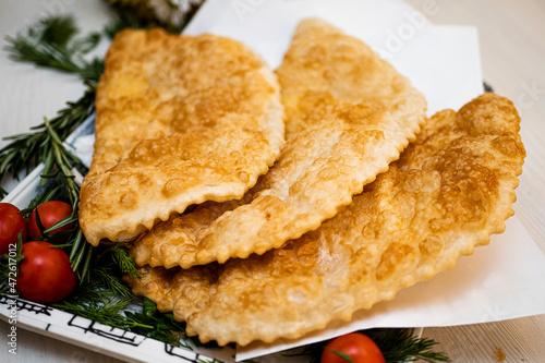 Juicy pasties with meat with a golden crust