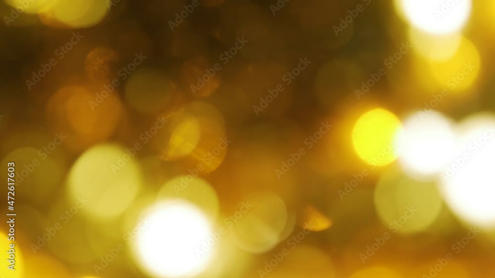 Abstract christmas background in bokeh. Yellow lights of blinking garland in blur. Unsharp bulbs of Christmas decorations. Festive mood. Animated background for text or pictures. New Year holiday Abstract christmas background in bokeh. Yellow lights of blinking garland in blur. Unsharp bulbs of Christmas decorations. Festive mood. Animated background for text or pictures. New Year holiday