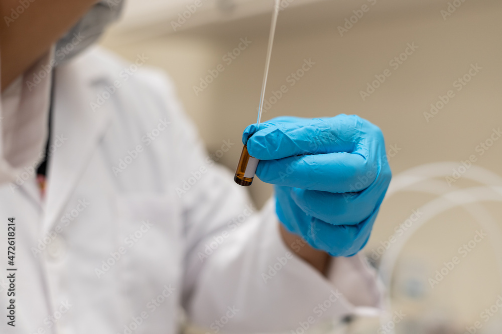technicians and scientist holding flask with lab glassware and test tubes in chemical medical or biological laboratory during covid-19, science research and development concept technicians and scientist holding flask with lab glassware and test tubes in chemical medical or biological laboratory during covid-19, science research and development concept