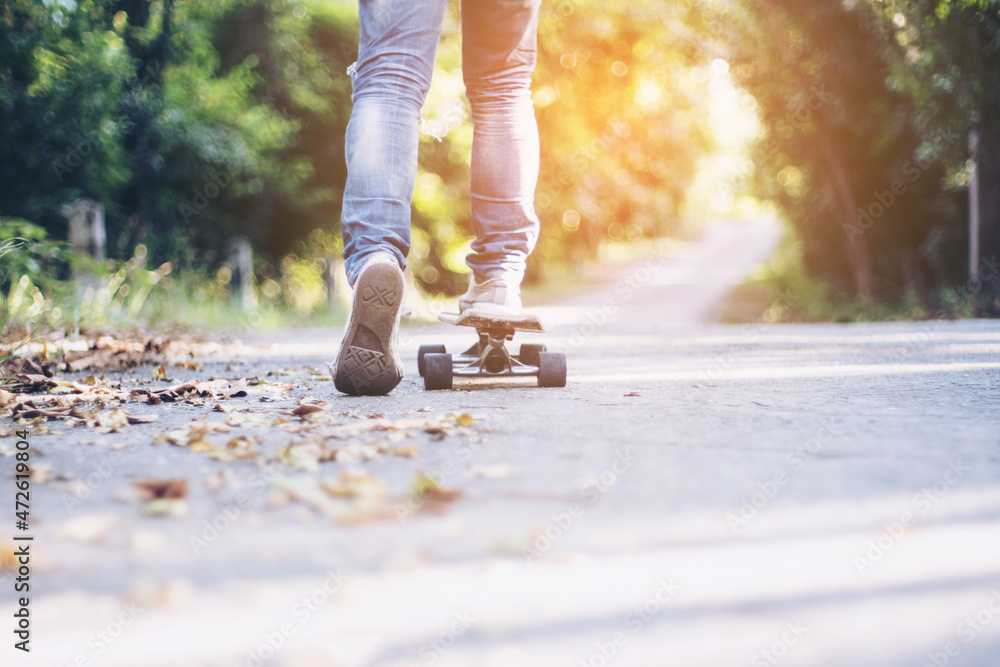 Close-up leg on surf skate on the road, Sport activity lifestyle concept, Healthy and exercise. Close-up leg on surf skate on the road, Sport activity lifestyle concept, Healthy and exercise.