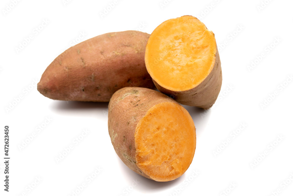 sweet potatoes on a white background. cut sweet potatoes. horizontal view. close up sweet potatoes on a white background. cut sweet potatoes. horizontal view. close up