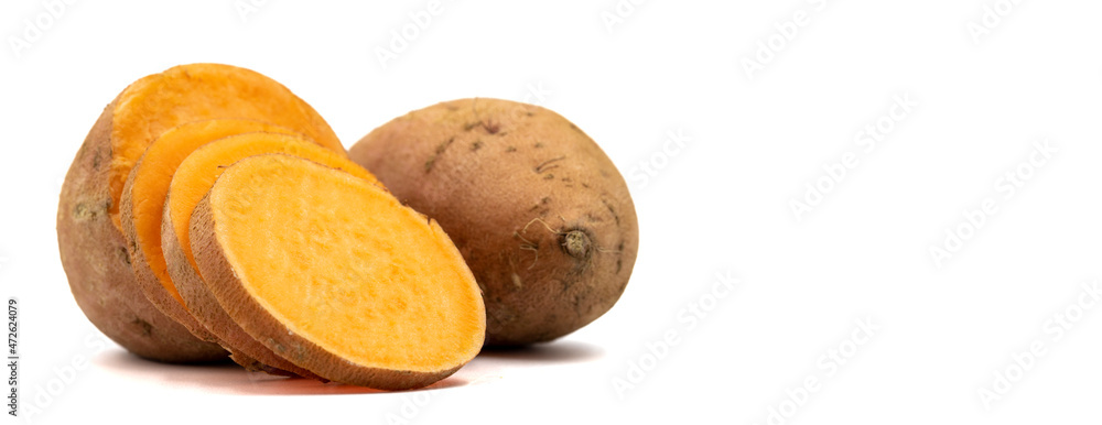 sweet potatoes on a white background. Sliced sweet potato. Empty space for text. Copy space. horizontal view. close up sweet potatoes on a white background. Sliced sweet potato. Empty space for text. Copy space. horizontal view. close up