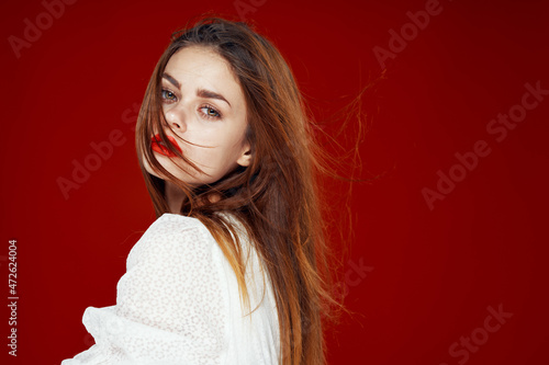 fashionable woman with red lips in red white dress isolated background