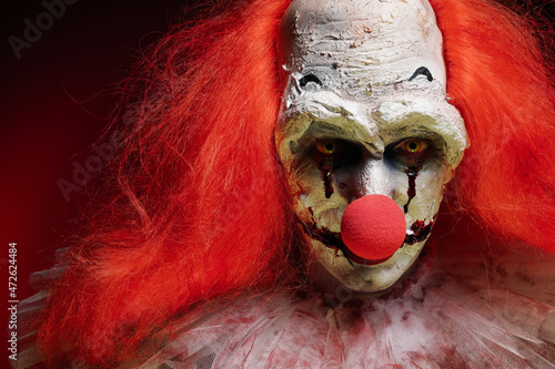 Papier peint Portrait of terrifying clown, closeup. Halloween party costume