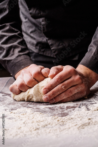 pastry chef prepares yeast dough for pizza pasta.