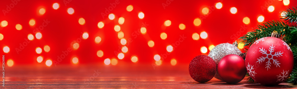 Christmas decoration on wooden table with red background and bokeh lights Christmas decoration on wooden table with red background and bokeh lights