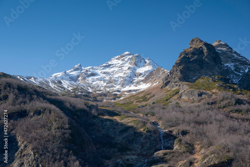 Scenic autumn mountain landscape with snow peaks  Tuymazinsky glacier  Digor Gorge  Northern Ossetia  Caucasus  Russia