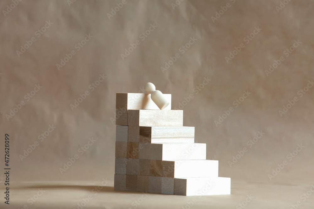 Wooden man falls from a professional ladder. - obrazy, fototapety, plakaty 