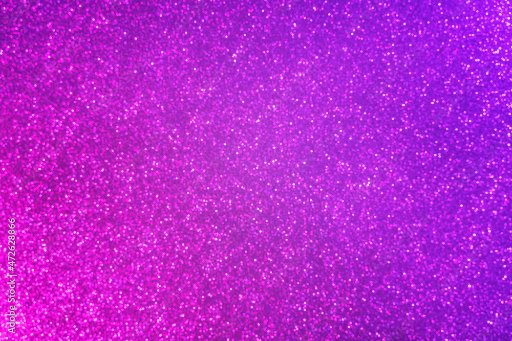 Abstract neon purple and pink gradient glitter background. Great backdrop for any holiday or event. Bokeh light overlay. Color gradient glow.