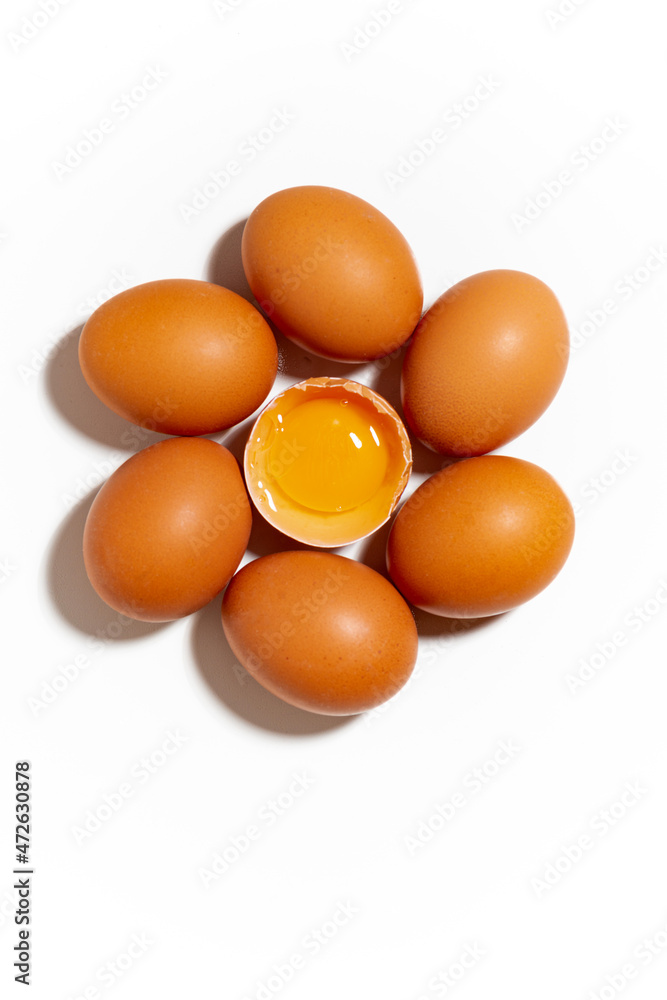 fresh chicken eggs on white background, one broken egg, vertical fresh chicken eggs on white background, one broken egg, vertical