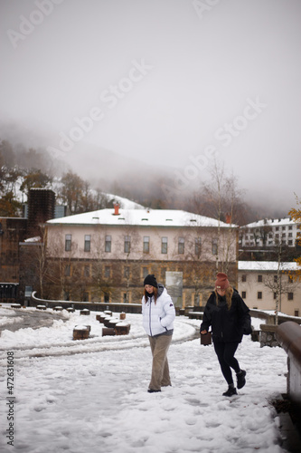 young friends enjoying in the snow
